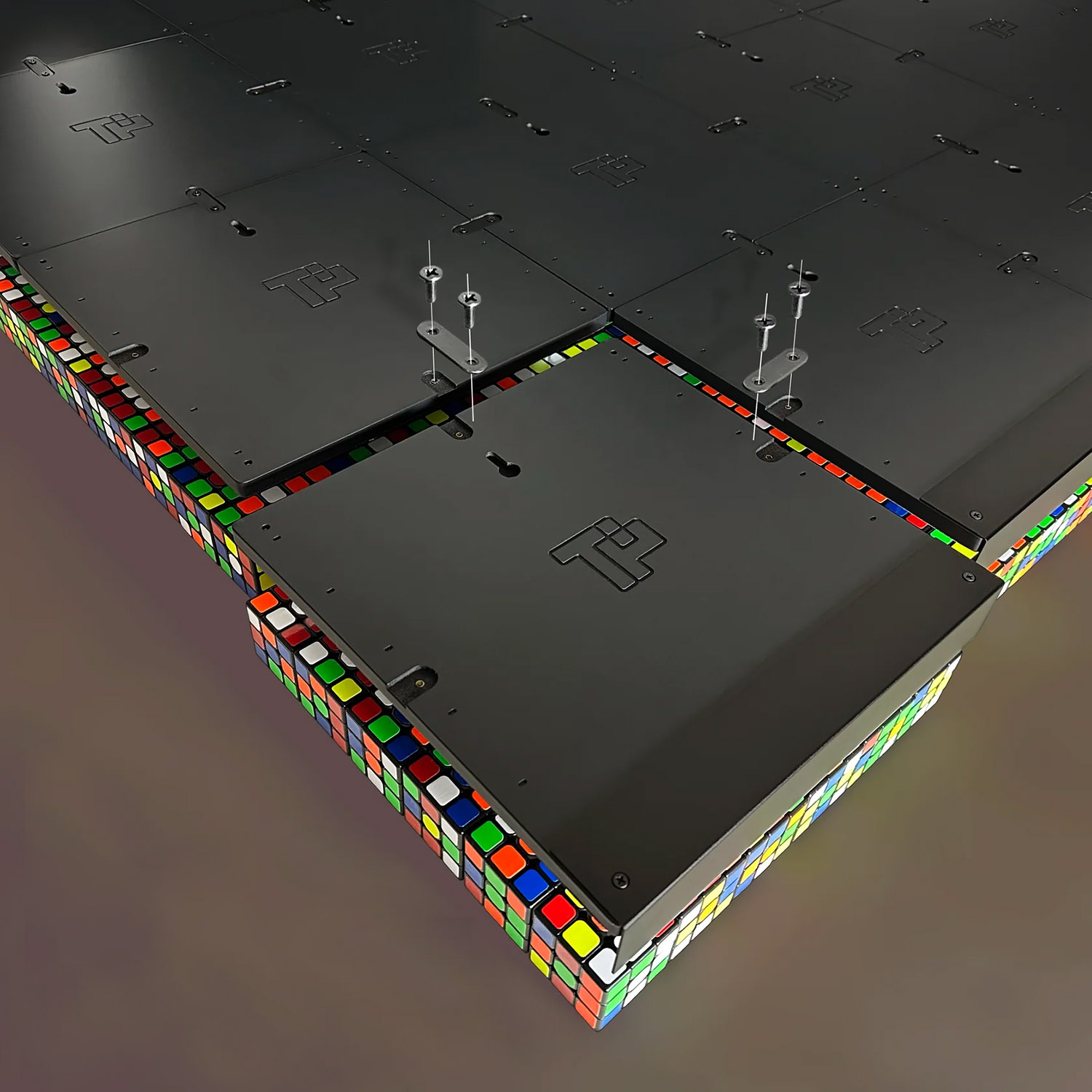 Back view of custom Rubik’s Cube mosaic artwork showing a professional hidden mounting system designed to support large-scale wall installations