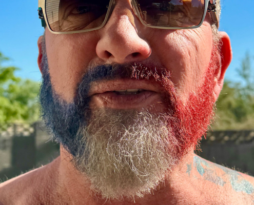 Brian Bemo with a red white and blue beard celebrating the Fourth of July