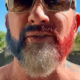 Brian Bemo with a red white and blue beard celebrating the Fourth of July
