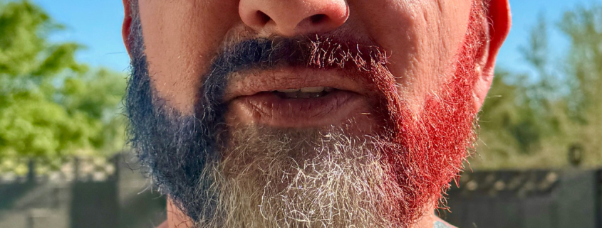 Brian Bemo with a red white and blue beard celebrating the Fourth of July
