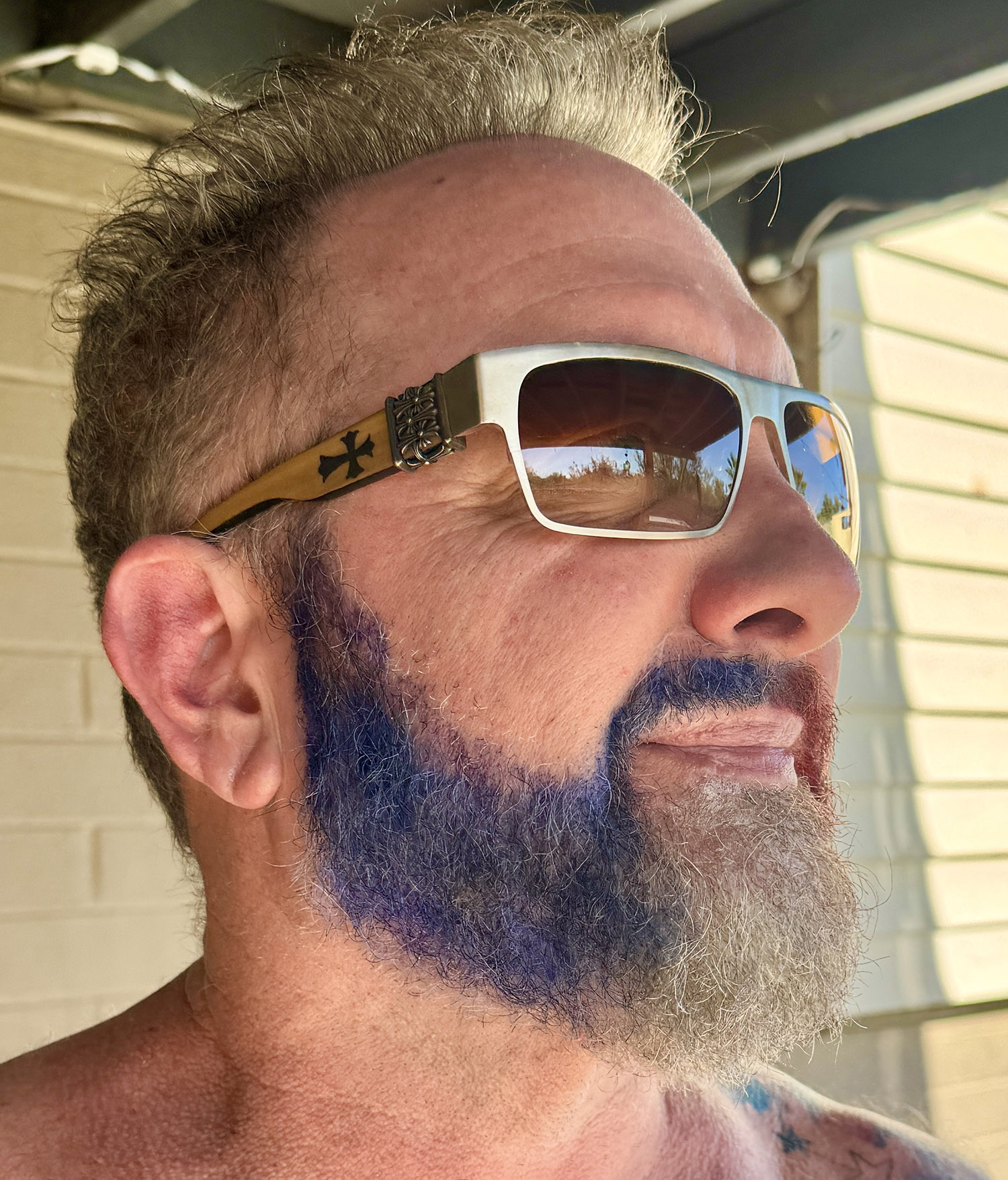 Patriotic Fourth of July beard painted red white and blue with temporary hair spray.